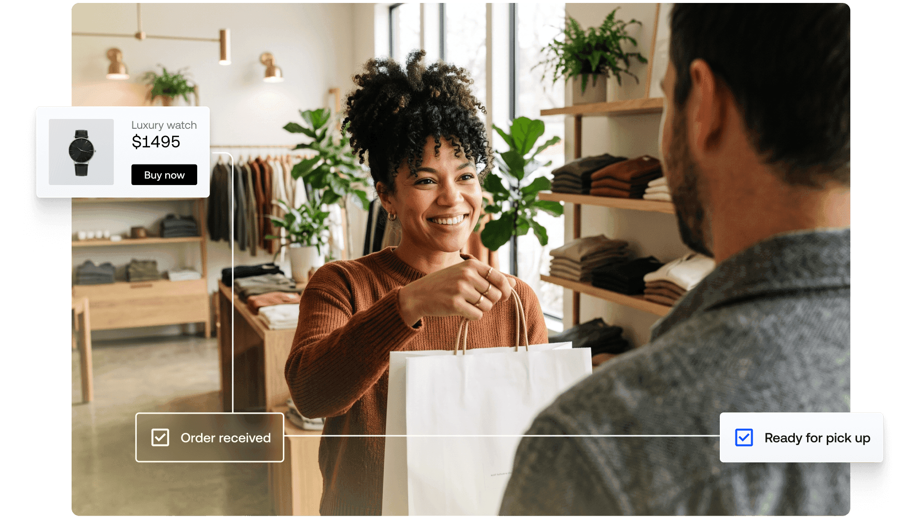 Retail associate handing a white paper shopping bag to a customer inside a boutique store.